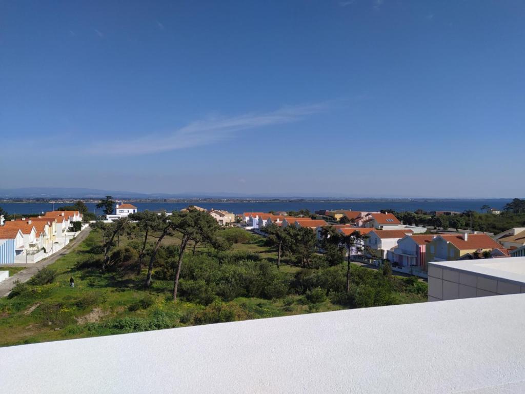 a view of a city from the balcony of a house at Apartamento em Torreira - Nenúfares in Torreira