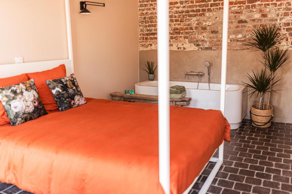 Postel nebo postele na pokoji v ubytování B&B Maison Lize
