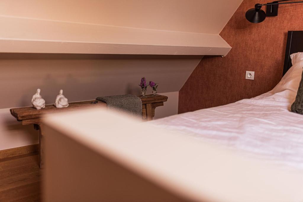 Postel nebo postele na pokoji v ubytování B&B Maison Lize