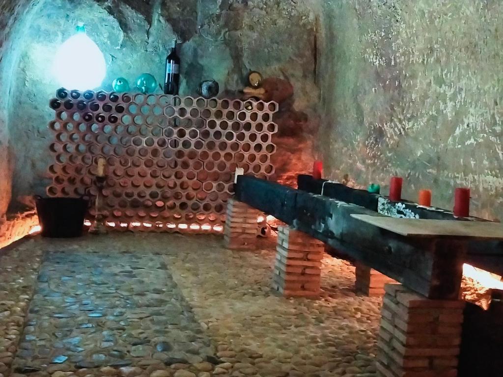 a room with a table and a bunch of pipes at Casa Bodega Vacacional in Sajazarra
