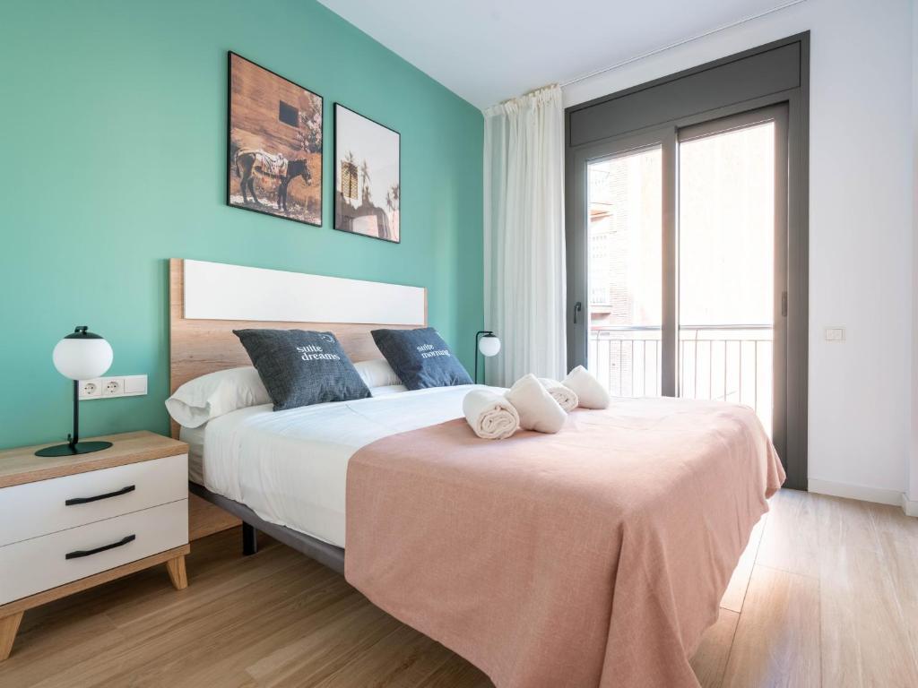 Postel nebo postele na pokoji v ubytování Limehome Barcelona Carrer de Besalú 90 - estancia temporal