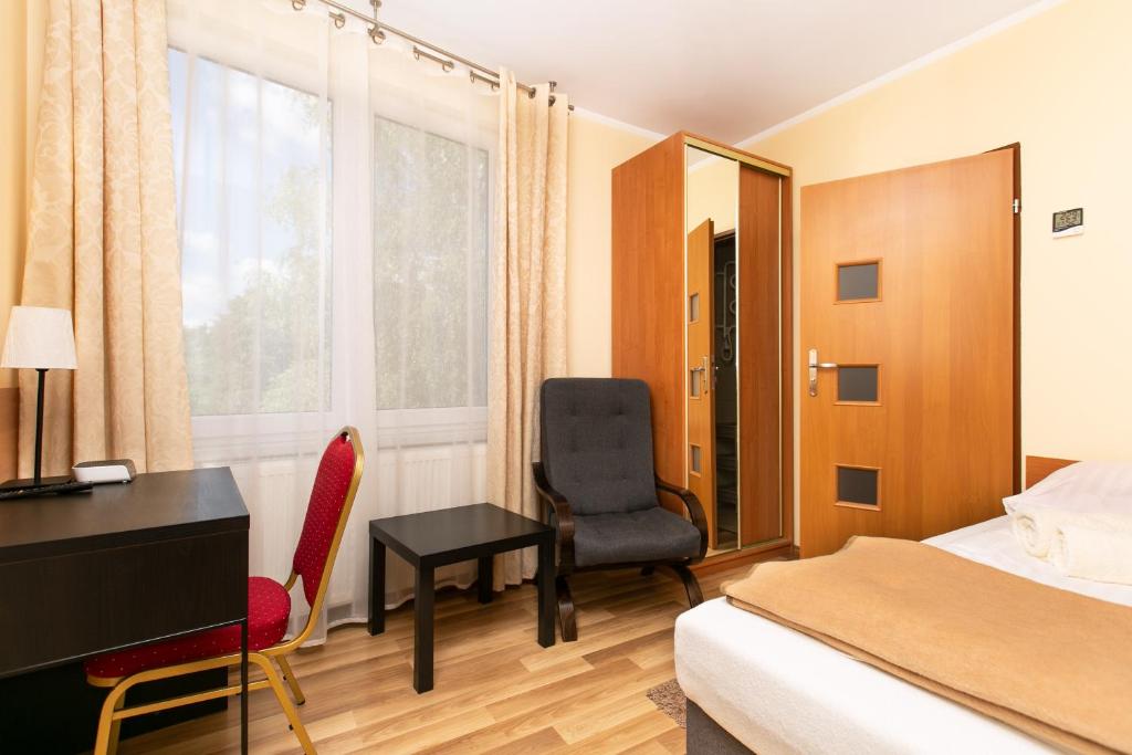 Postel nebo postele na pokoji v ubytování Korona Żywca