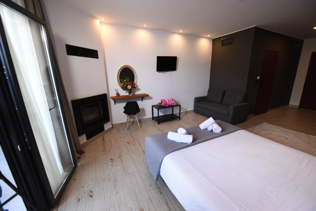 Postel nebo postele na pokoji v ubytování Hotel Koferita