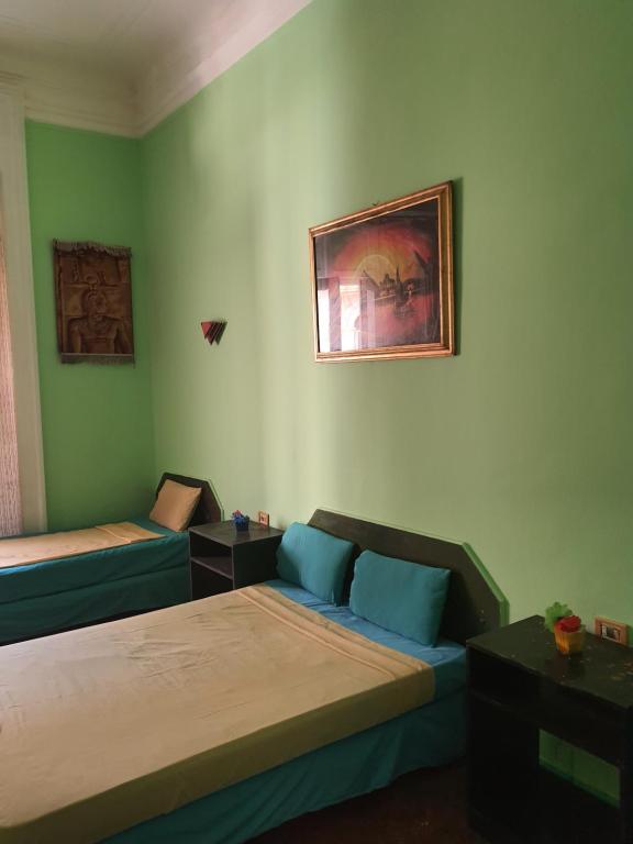 Postel nebo postele na pokoji v ubytování African House Hostel