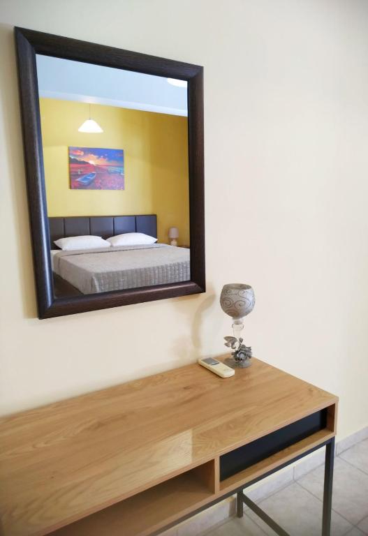 A bed or beds in a room at OSCAR STUDIO KALAMATA city centre