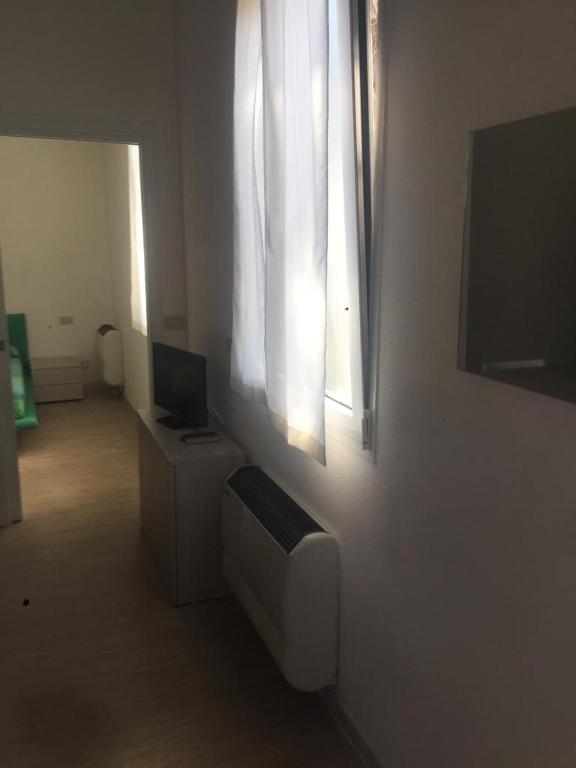 TV a/nebo společenská místnost v ubytování Residences La Rustica & Elite