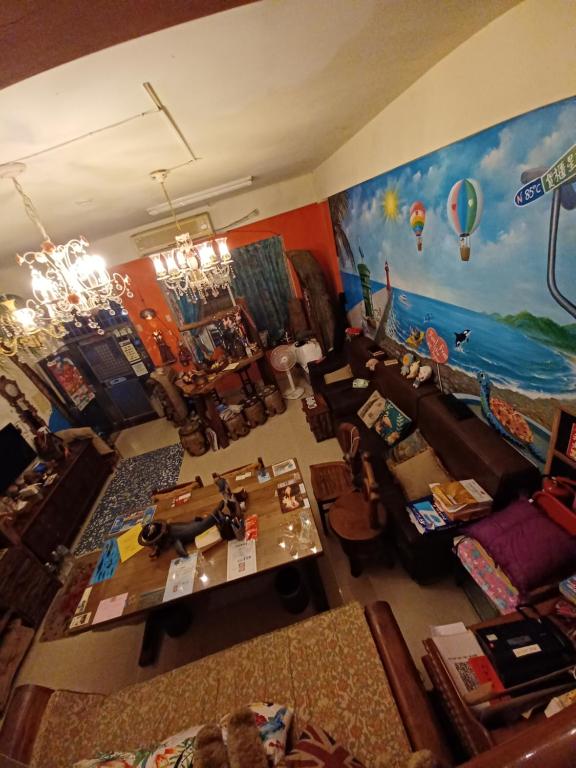 an overhead view of a living room with a painting at Hualien Seaside B&amp;B in Hualien City