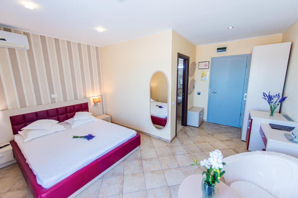 Postel nebo postele na pokoji v ubytování Hotel Prestige