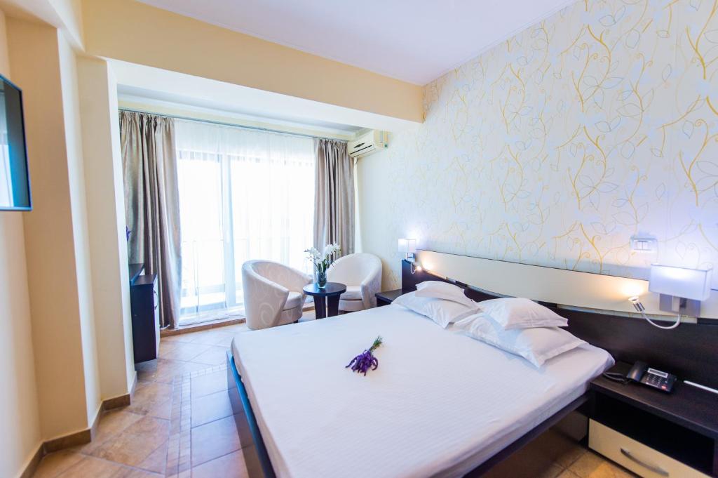 Postel nebo postele na pokoji v ubytování Hotel Prestige