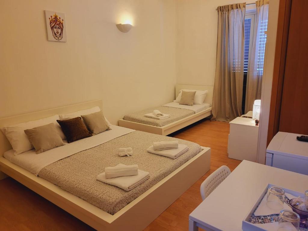 Postel nebo postele na pokoji v ubytování La Perla Di Noto
