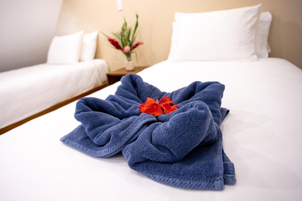 Postel nebo postele na pokoji v ubytování Aves Hotel Montezuma