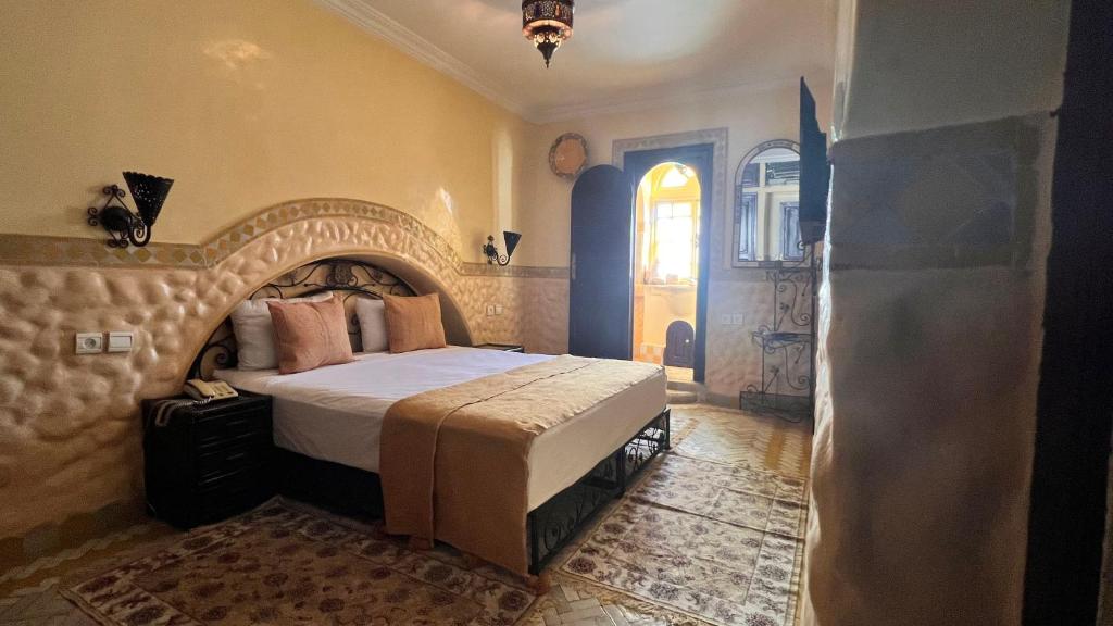 Postel nebo postele na pokoji v ubytování Riad Catalina