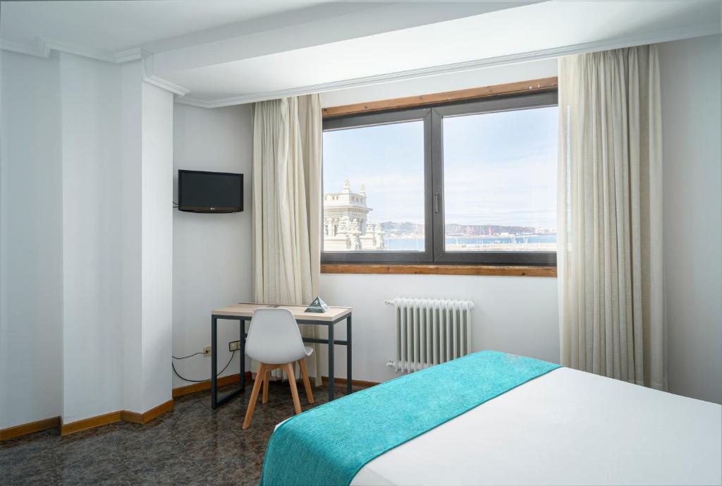 Postel nebo postele na pokoji v ubytování Hotel Alda Pasaje
