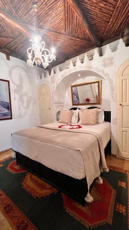 Postel nebo postele na pokoji v ubytování Riad Catalina