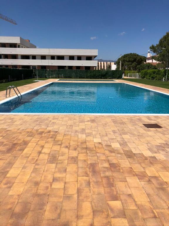 Bazén v ubytovaní ROQUES DAURADES III - JARDIN PRIVADO alebo v jeho blízkosti