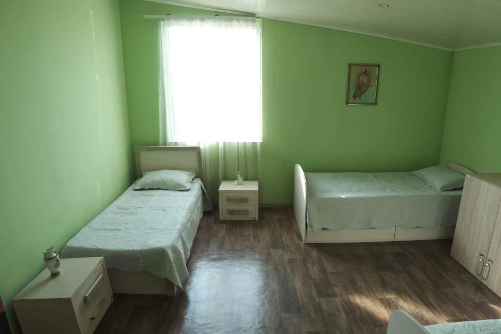Postel nebo postele na pokoji v ubytování НордВест