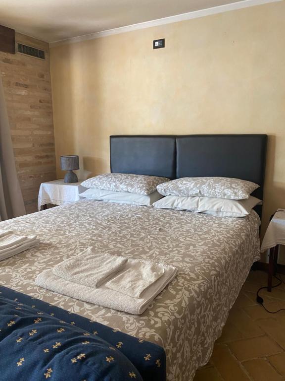 A bed or beds in a room at Rustico Althea - immerso nel verde