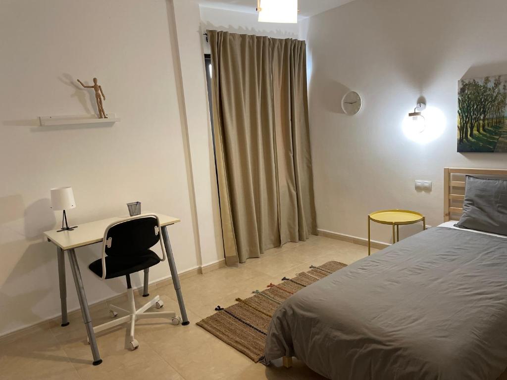 Postel nebo postele na pokoji v ubytování Increíble apartamento en pleno centro de Arrecife con parking privado