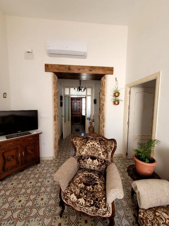 TV a/nebo společenská místnost v ubytování Casa rural La Golondrina