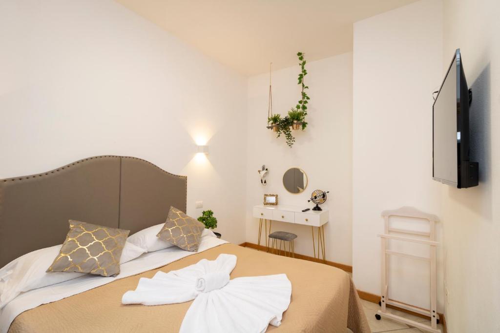 Postel nebo postele na pokoji v ubytování Vitti's Home Verona 3