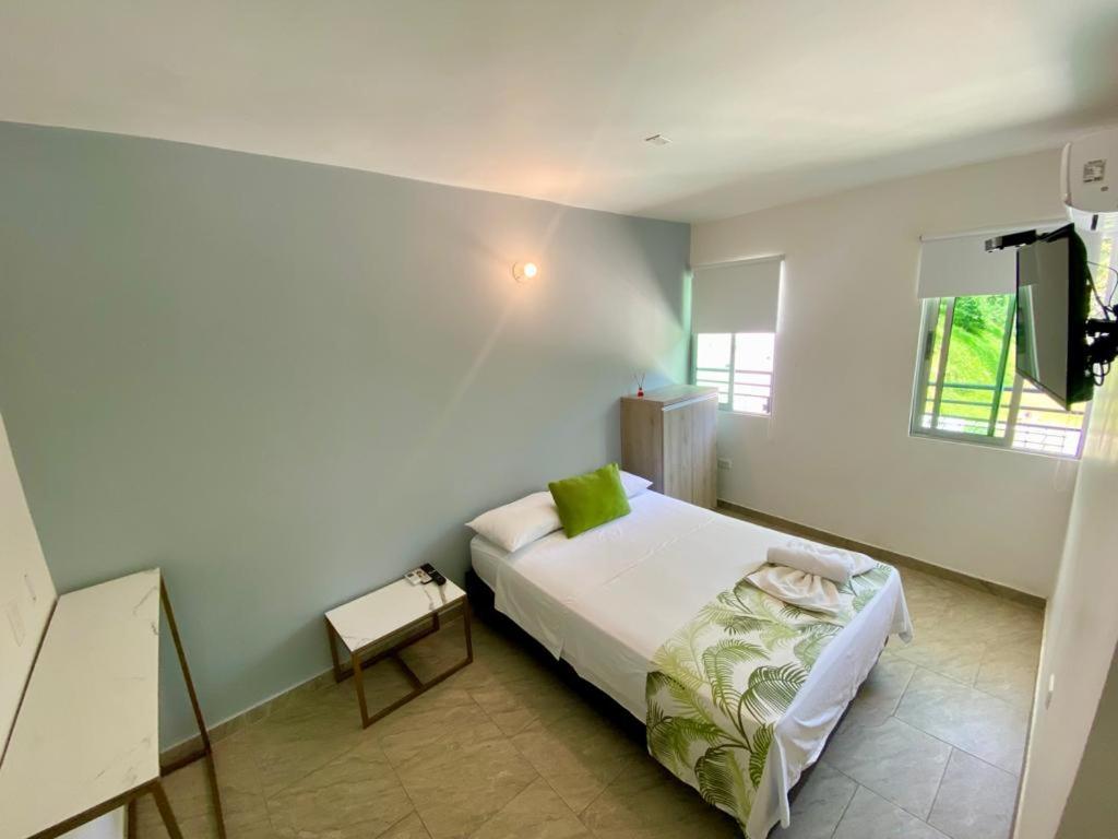 Postel nebo postele na pokoji v ubytování Biohotel Rio Claro