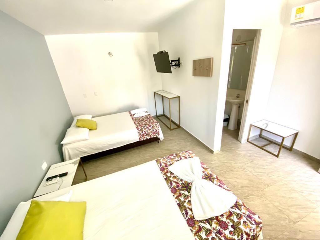 Postel nebo postele na pokoji v ubytování Biohotel Rio Claro