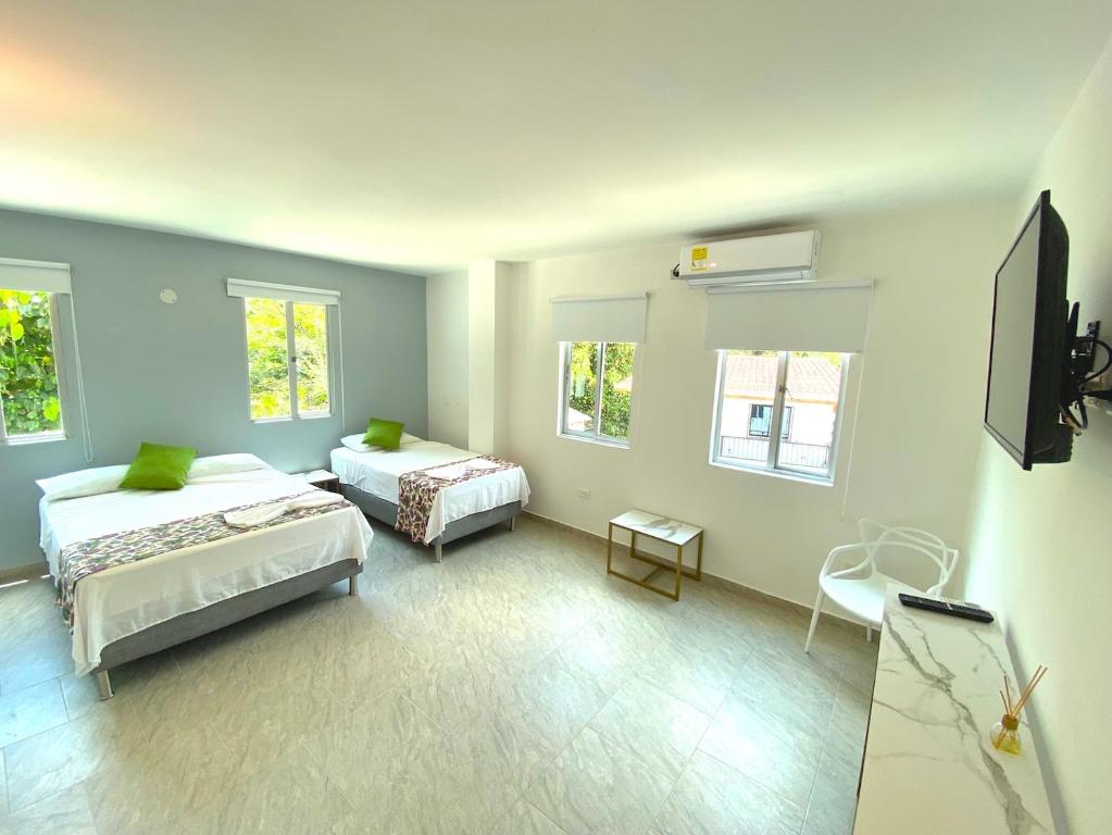 Postel nebo postele na pokoji v ubytování Biohotel Rio Claro