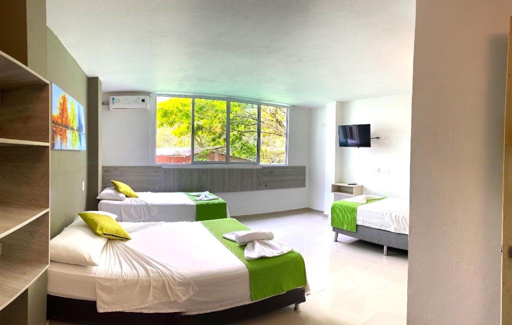 Postel nebo postele na pokoji v ubytování Biohotel Rio Claro