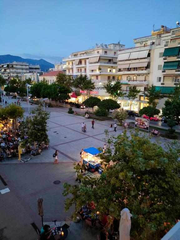 a group of people in a courtyard in a city at CA Comfort Living in Kalamata