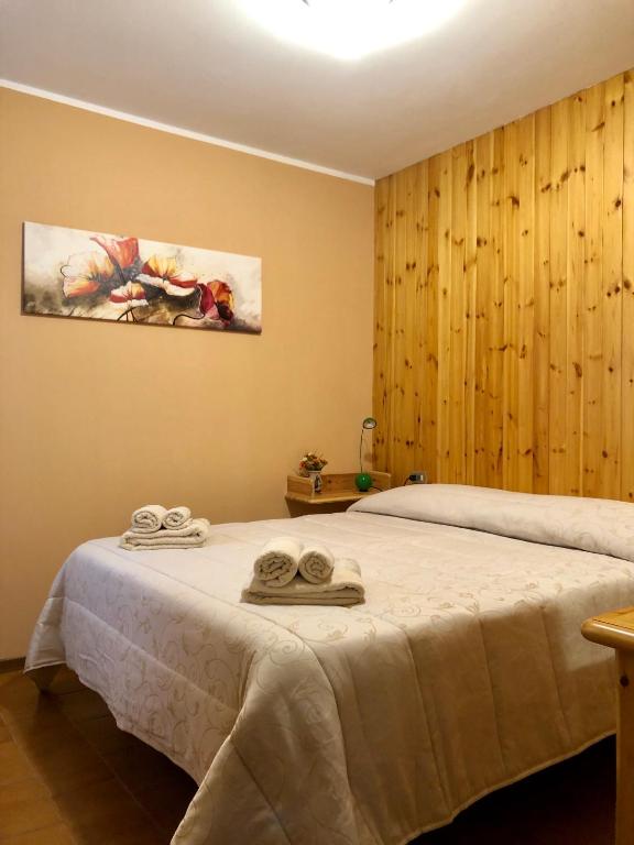 Postel nebo postele na pokoji v ubytování Appartamento Pian di Neve