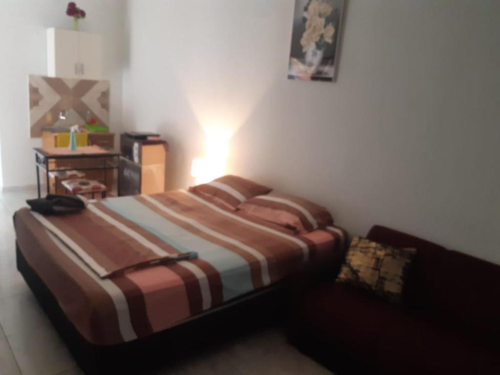 Voodi või voodid majutusasutuse Adorable monoambiente en Asunción toas
