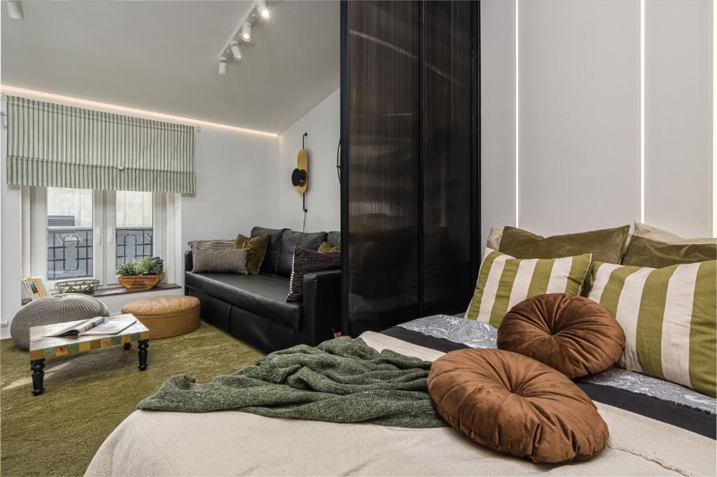 Posteľ alebo postele v izbe v ubytovaní West Side Piotrkowska Apartment
