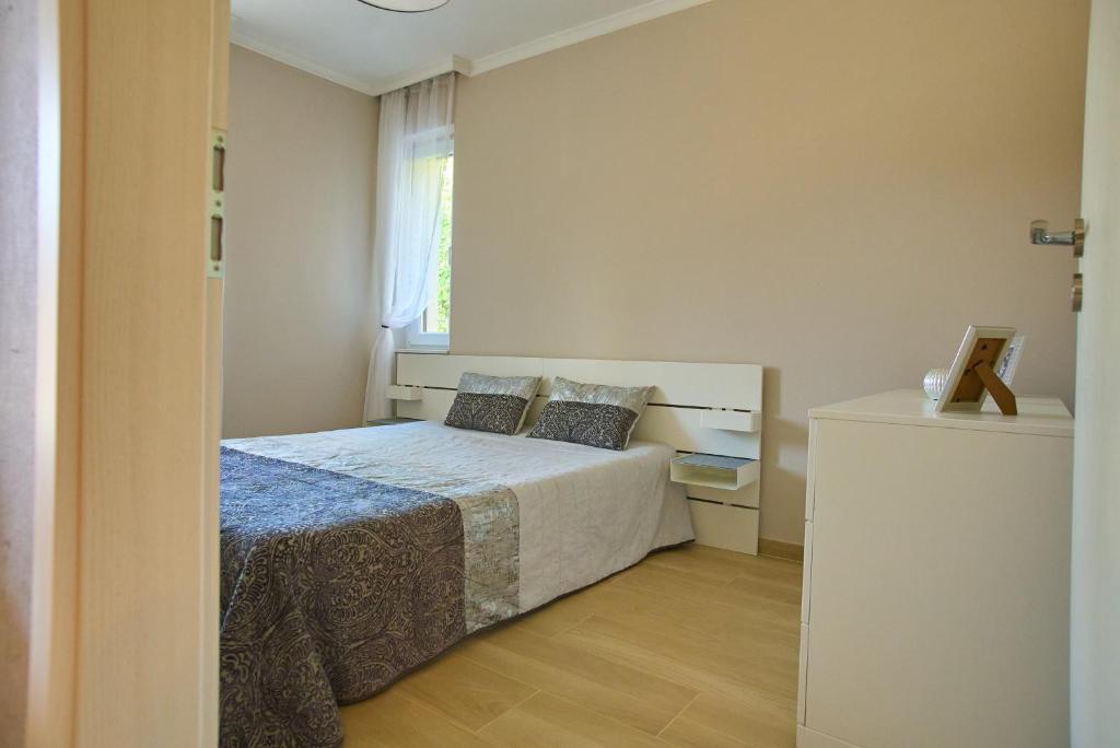 Łóżko lub łóżka w pokoju w obiekcie SUNLIGHT GREY - Szeged