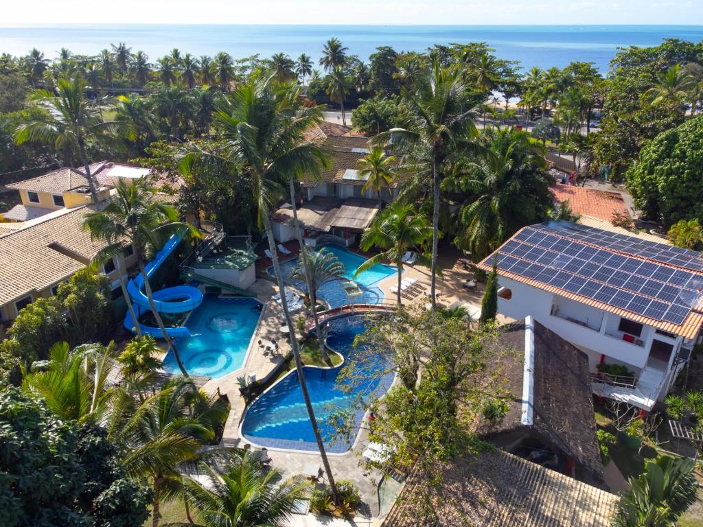 an aerial view of the pool at the resort at Ramada by Wyndham Porto Seguro Praia in Porto Seguro