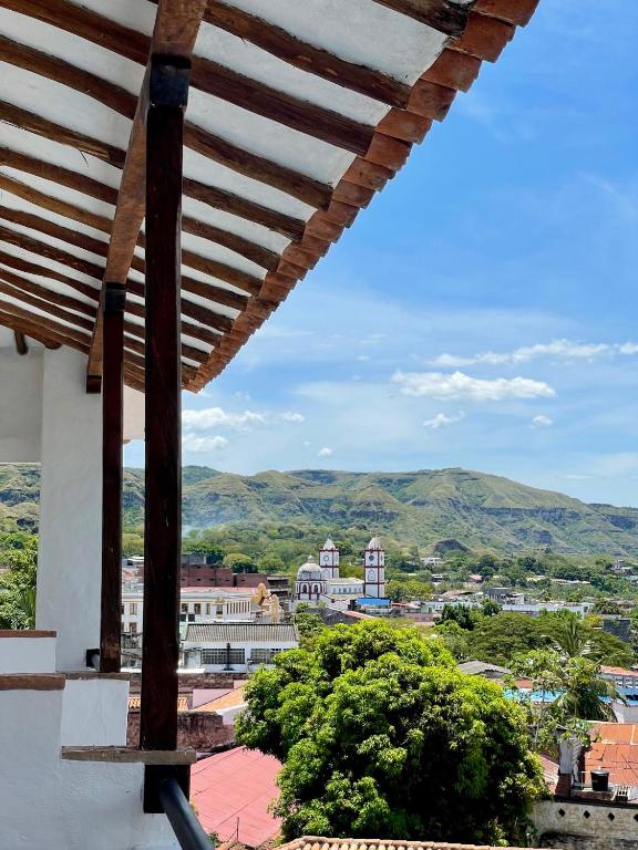 a view from the balcony of a building with mountains in the background at Hotel Boutique Posada Las Trampas in Honda