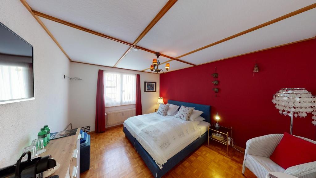 Postel nebo postele na pokoji v ubytování BnB Haus Weibel