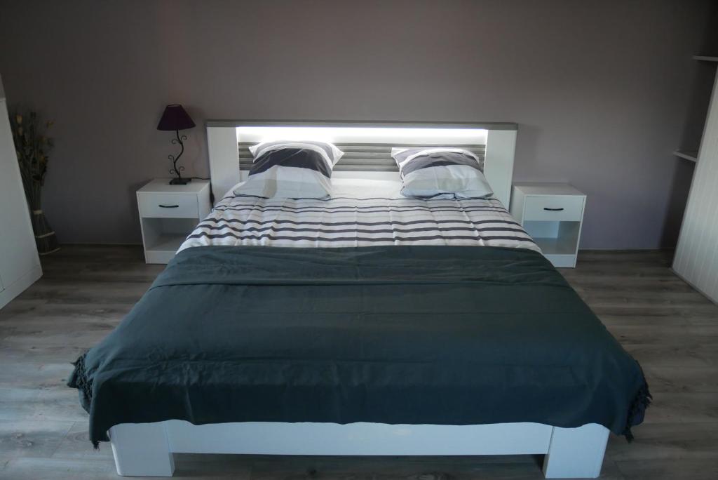 Posteľ alebo postele v izbe v ubytovaní La Petite Maison