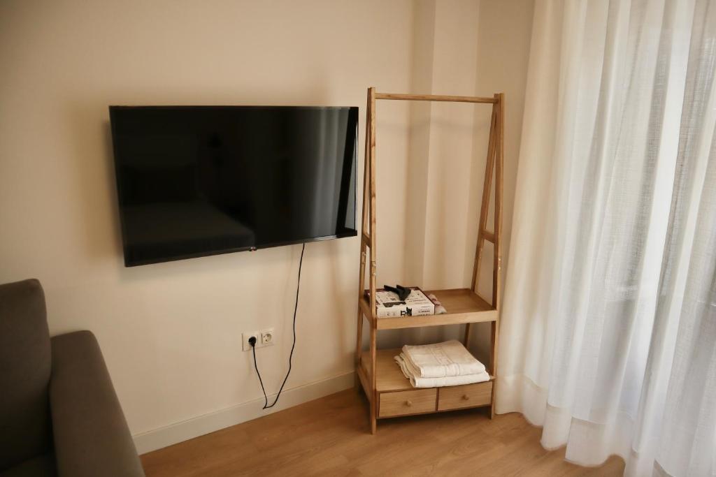 Televízia a/alebo spoločenská miestnosť v ubytovaní Merced10 1A