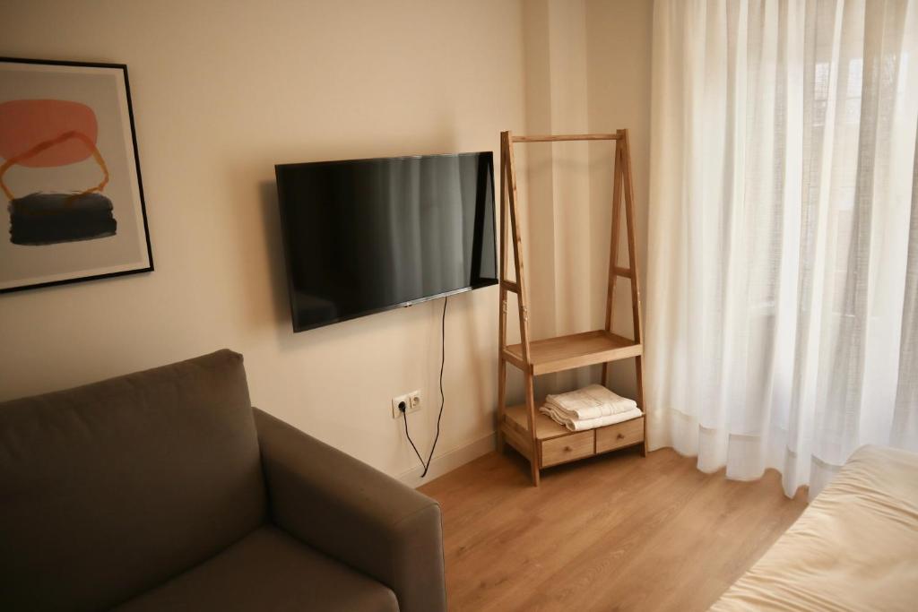 Televízia a/alebo spoločenská miestnosť v ubytovaní Merced10 1A
