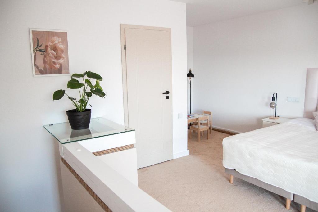 Posteľ alebo postele v izbe v ubytovaní Apartament Ósemka