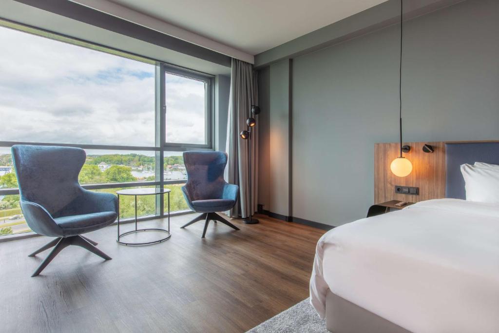 Postel nebo postele na pokoji v ubytování Radisson Blu Hotel Rostock