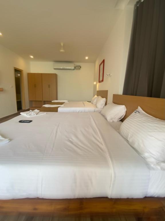 Postel nebo postele na pokoji v ubytování Hotel Bluestone