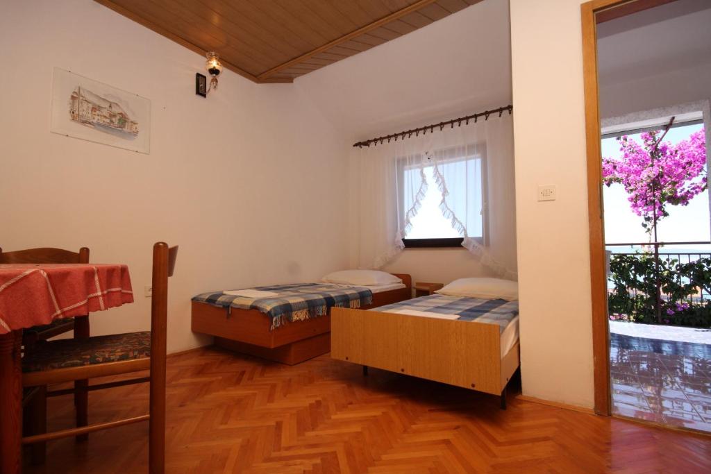 Fotografia z galérie ubytovania Apartments and rooms with parking space Podgora, Makarska - 6790 v Podgore