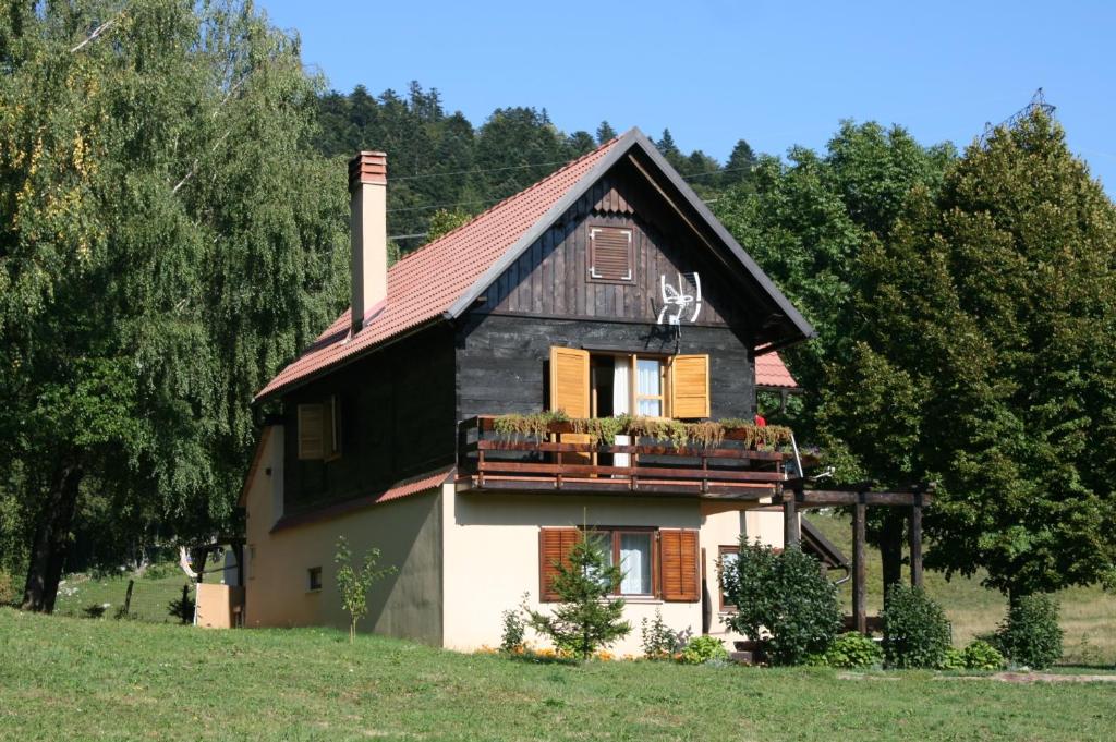 a house with a black and white at Family friendly house with a swimming pool Breze, Novi Vinodolski - 6920 in Ledenice