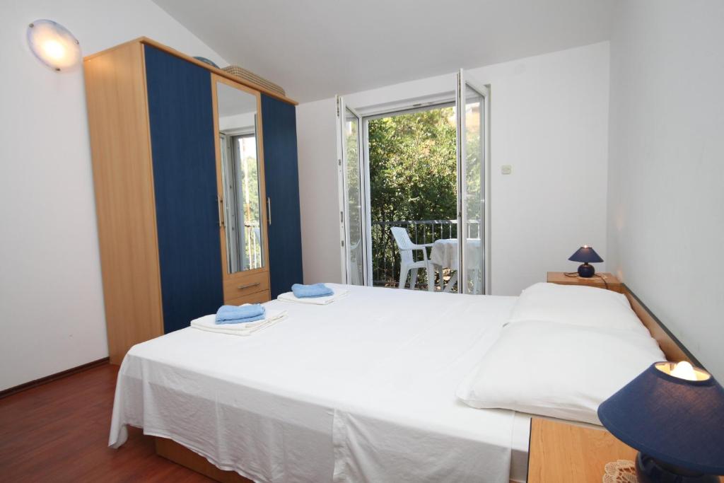Postel nebo postele na pokoji v ubytování Apartment Pasadur 8337g