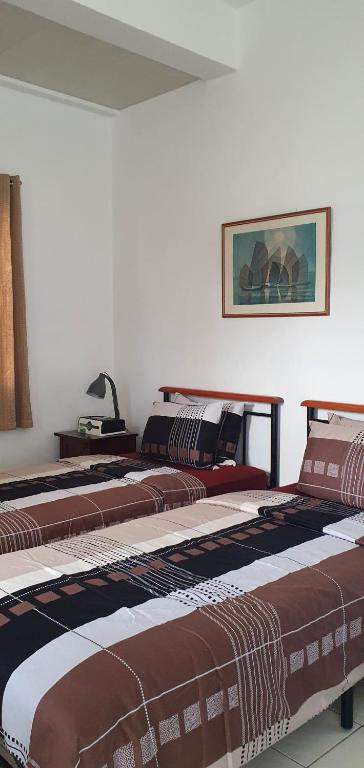 Postel nebo postele na pokoji v ubytování Lola's Guest House