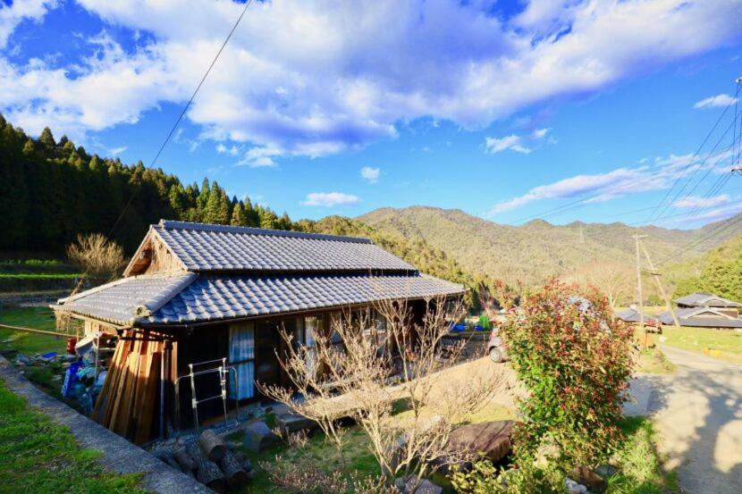 a small house with a solar roof on top of it at 里山の花乃家 in Tanikawa