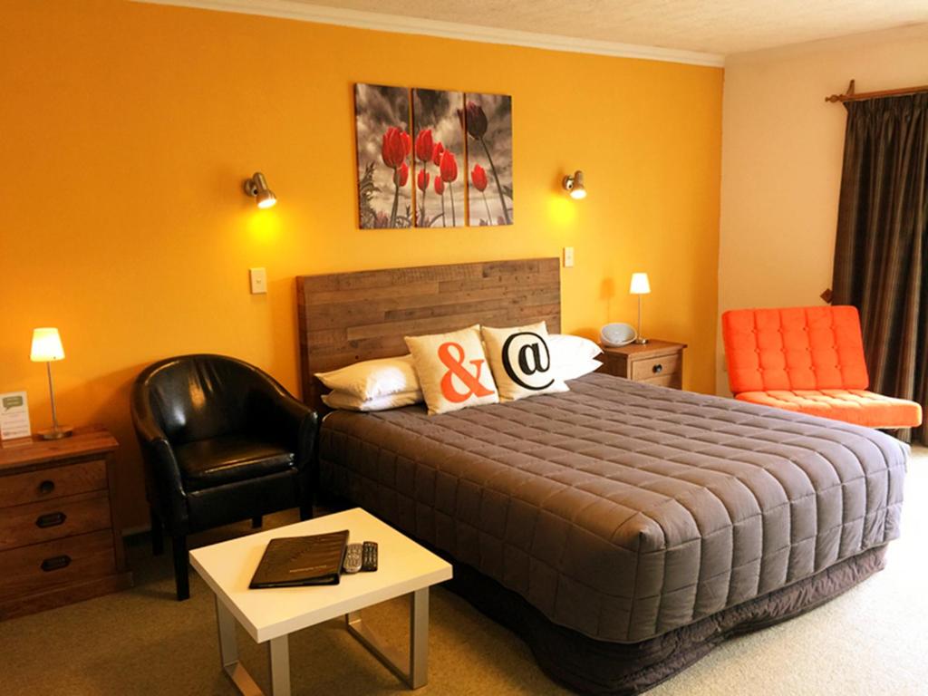 Postel nebo postele na pokoji v ubytování Rotorua Coachman Spa Motel