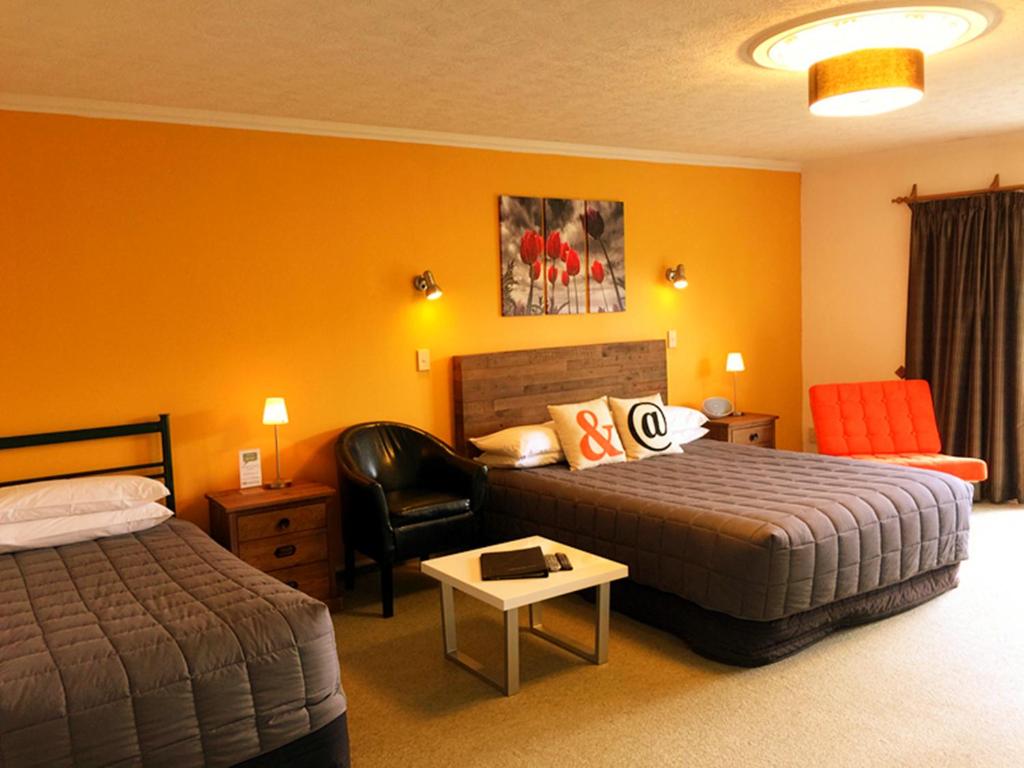 Postel nebo postele na pokoji v ubytování Rotorua Coachman Spa Motel