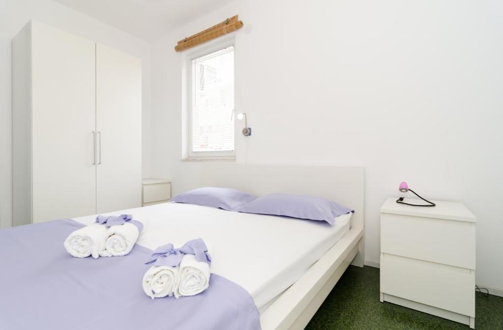 Posteľ alebo postele v izbe v ubytovaní Apartments by the sea Dubrovnik - 8544
